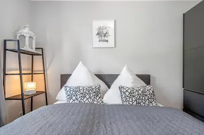 Ein Bett oder Betten in einem Zimmer der Unterkunft Zur Meeresmuschel Nr.10