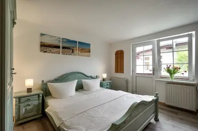 Ein Bett oder Betten in einem Zimmer der Unterkunft Appartementhaus Bergstraße