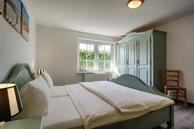 Ein Bett oder Betten in einem Zimmer der Unterkunft Appartementhaus Bergstraße
