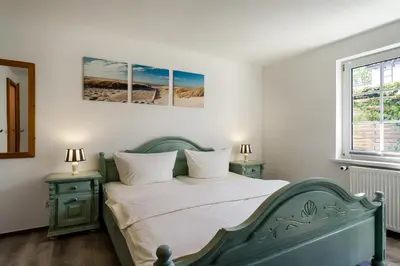 Ein Bett oder Betten in einem Zimmer der Unterkunft Appartementhaus Bergstraße