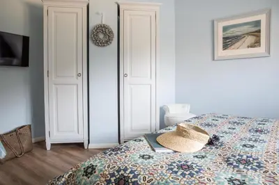 Ein Bett oder Betten in einem Zimmer der Unterkunft Ferienhaus Haubenlerche 14