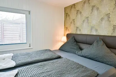 Ein Bett oder Betten in einem Zimmer der Unterkunft Haus Windhook