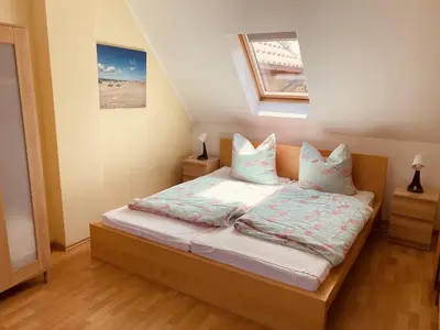 Ein Bett oder Betten in einem Zimmer der Unterkunft Ferienwohnungen am Badesteig - dem Strand so nah