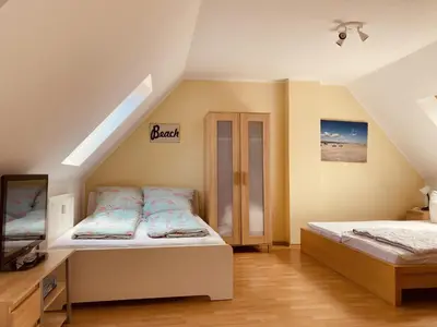 Ein Bett oder Betten in einem Zimmer der Unterkunft Ferienwohnungen am Badesteig - dem Strand so nah