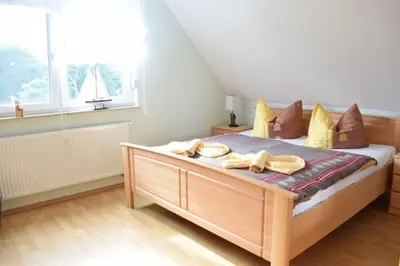 Ein Bett oder Betten in einem Zimmer der Unterkunft Ferienwohnungen am Badesteig - dem Strand so nah