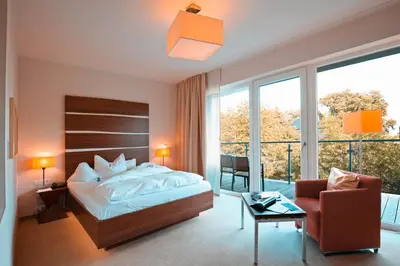 Ein Bett oder Betten in einem Zimmer der Unterkunft THE GRAND Ahrenshoop