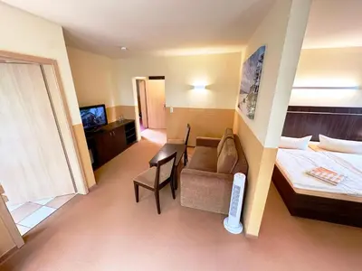 Ein Bett oder Betten in einem Zimmer der Unterkunft Hotel Strandburg Prerow