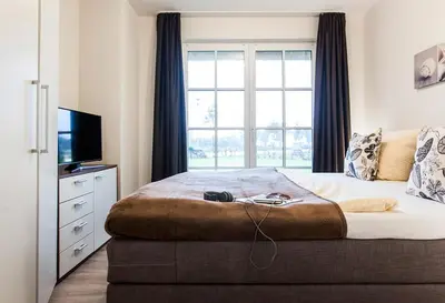 Ein Bett oder Betten in einem Zimmer der Unterkunft Ferienhaus Haubenlerche 40