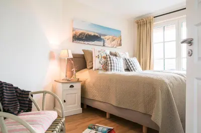 Ein Bett oder Betten in einem Zimmer der Unterkunft Ferienhaus Haubenlerche 59