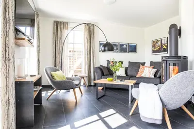 Ein Sitzbereich in der Unterkunft Ferienhaus Schilfrohrsaenger 26