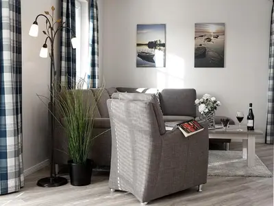 Ein Sitzbereich in der Unterkunft Ferienhaus Schilfrohrsaenger 28