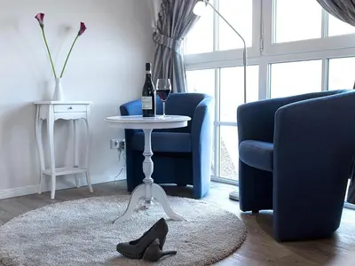 Ein Sitzbereich in der Unterkunft Ferienhaus Schilfrohrsaenger 28