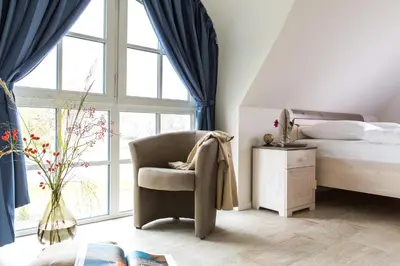 Ein Bett oder Betten in einem Zimmer der Unterkunft Ferienhaus Schilfrohrsaenger 31