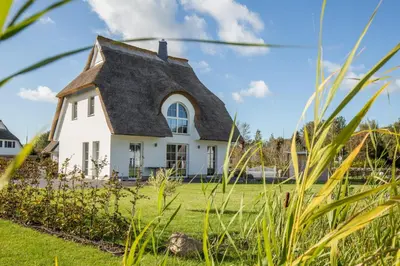 Ein Garten an der Unterkunft Ferienhaus Schilfrohrsaenger 31