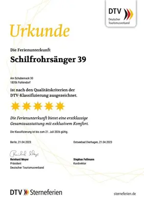 Ein Zertifikat, Auszeichnung, Logo oder anderes Dokument, das in der Unterkunft Ferienhaus Schilfrohrsaenger 39 ausgestellt ist