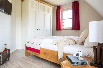Ein Bett oder Betten in einem Zimmer der Unterkunft Ferienhaus Schilfrohrsaenger 43