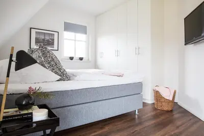 Ein Bett oder Betten in einem Zimmer der Unterkunft Ferienhaus Schilfrohrsaenger 45