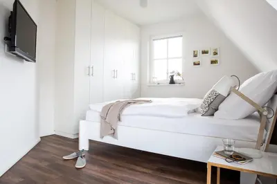 Ein Bett oder Betten in einem Zimmer der Unterkunft Ferienhaus Schilfrohrsaenger 45