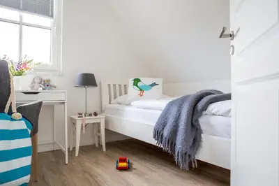 Ein Bett oder Betten in einem Zimmer der Unterkunft Ferienhaus Schilfrohrsaenger 54