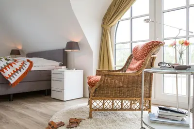 Ein Sitzbereich in der Unterkunft Ferienhaus Schilfrohrsaenger 54