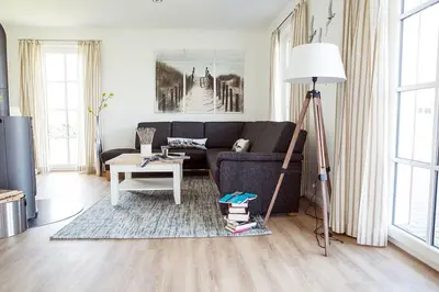 Ein Sitzbereich in der Unterkunft Ferienhaus Schilfrohrsaenger 61