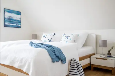 Ein Bett oder Betten in einem Zimmer der Unterkunft Ferienhaus Seeschwalbe 33