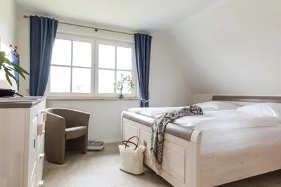 Ein Bett oder Betten in einem Zimmer der Unterkunft Ferienhaus Seeschwalbe 35
