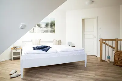Ein Bett oder Betten in einem Zimmer der Unterkunft Ferienwohnung Diek 1_5