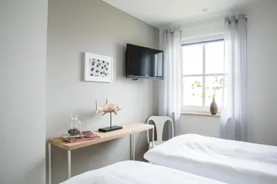 Ein Bett oder Betten in einem Zimmer der Unterkunft Ferienhaus Seeschwalbe 44