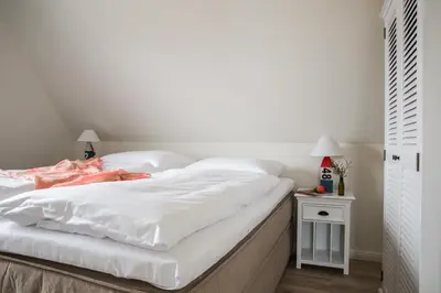 Ein Bett oder Betten in einem Zimmer der Unterkunft Ferienhaus Seeschwalbe 44