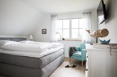 Ein Bett oder Betten in einem Zimmer der Unterkunft Ferienhaus Seeschwalbe 44