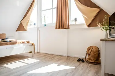 Ein Bett oder Betten in einem Zimmer der Unterkunft Ferienwohnung Buhnen 2_4