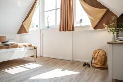 Ein Bett oder Betten in einem Zimmer der Unterkunft Ferienwohnung Drudenstein 1_4