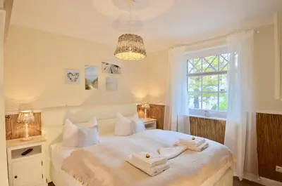 Ein Bett oder Betten in einem Zimmer der Unterkunft Villa Strandblick 4
