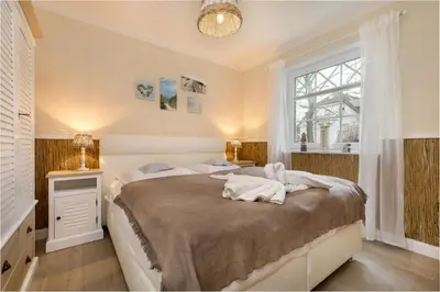 Ein Bett oder Betten in einem Zimmer der Unterkunft Villa Strandblick 4