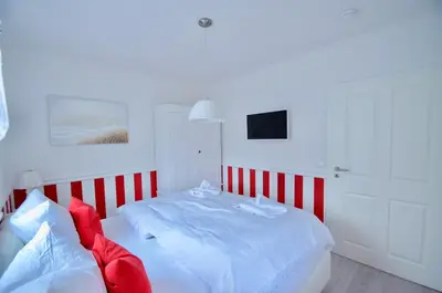Ein Bett oder Betten in einem Zimmer der Unterkunft Villa Strandblick 5