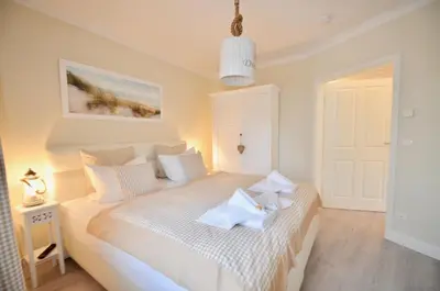 Ein Bett oder Betten in einem Zimmer der Unterkunft Villa Strandblick 5