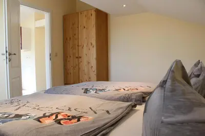 Ein Bett oder Betten in einem Zimmer der Unterkunft Hexenhaus Prerow - Ausguck