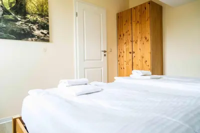 Ein Bett oder Betten in einem Zimmer der Unterkunft Hexenhaus Prerow - Ausguck