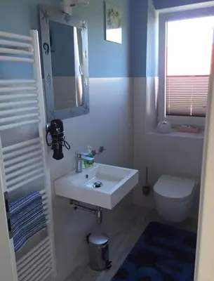 Ein Badezimmer in der Unterkunft 