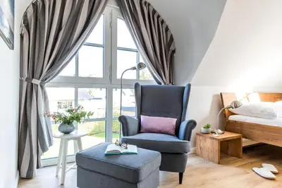 Ein Sitzbereich in der Unterkunft Ferienhaus Schilfrohrsaenger 36