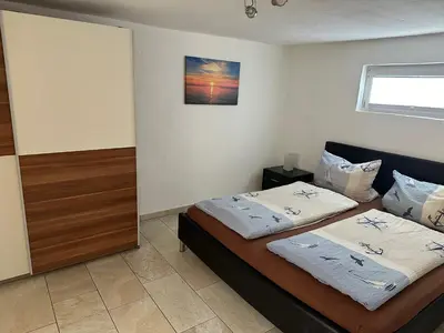 Ein Bett oder Betten in einem Zimmer der Unterkunft Haus auf der alten Düne
