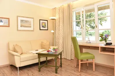 Ein Sitzbereich in der Unterkunft Romantik Hotel Fischerwiege
