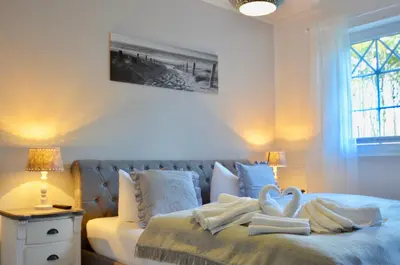 Ein Bett oder Betten in einem Zimmer der Unterkunft Villa Strandblick 10