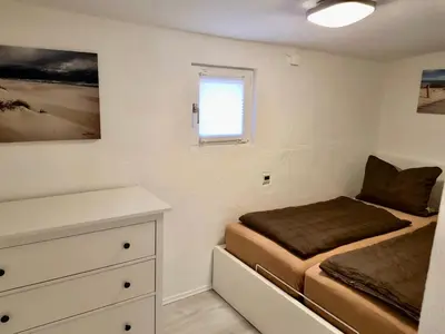 Ein Bett oder Betten in einem Zimmer der Unterkunft Haus auf der alten Düne 2