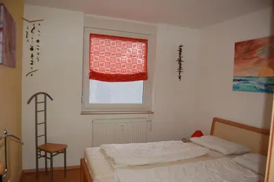Ein Bett oder Betten in einem Zimmer der Unterkunft Zum Sonnenuntergang
