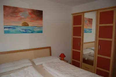 Ein Bett oder Betten in einem Zimmer der Unterkunft Zum Sonnenuntergang