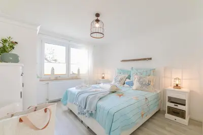 Ein Bett oder Betten in einem Zimmer der Unterkunft Boddenhaus Darss