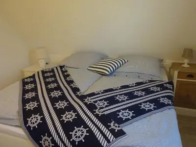 Ein Bett oder Betten in einem Zimmer der Unterkunft Boddenhaus Darss