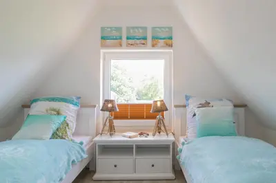Ein Bett oder Betten in einem Zimmer der Unterkunft Boddenhaus Darss